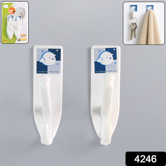 Wukusy heavy-duty self-adhesive plastic hook attached to a bathroom wall for hanging towels or accessories in home improvement.