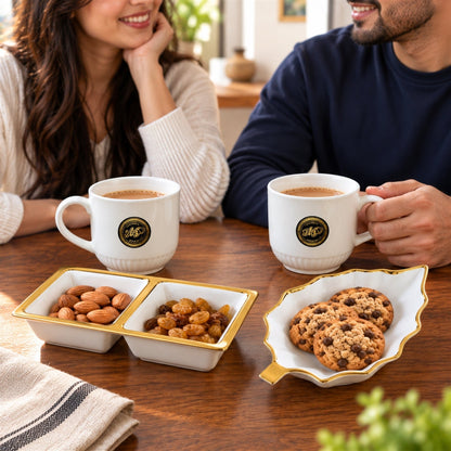 Wukusy tea and snacks serving set with cups, divided bowl, and leaf platter, displayed on a wooden table.