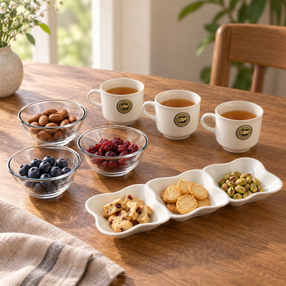 Wukusy 7-piece snack serving gift set with cups, bowls, and divided platter arranged on a table for serving snacks.