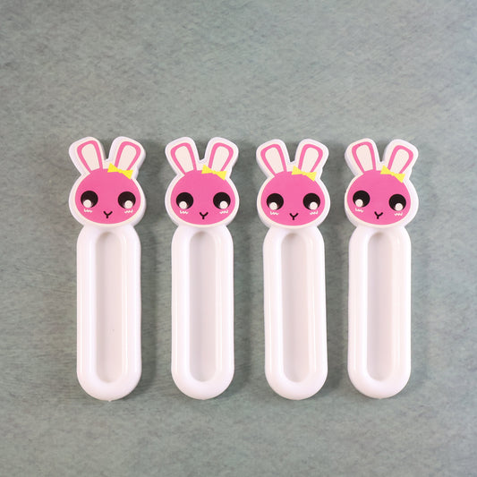 Set of four Wukusy Self Stick Push Pull Helpers for home and kitchen, designed to assist with opening doors and drawers.