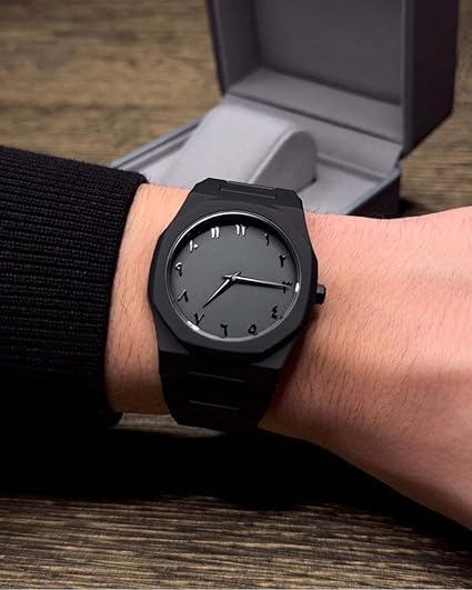 Dropdash kids matte black analog wristwatch with Eastern Arabic dial, featuring a sleek black strap and clear Arabic numerals.