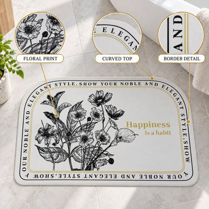 Absorbent half-round bathroom mat by Wukusy featuring botanical quote print, measuring 50x80 cm, with a soft, plush texture.