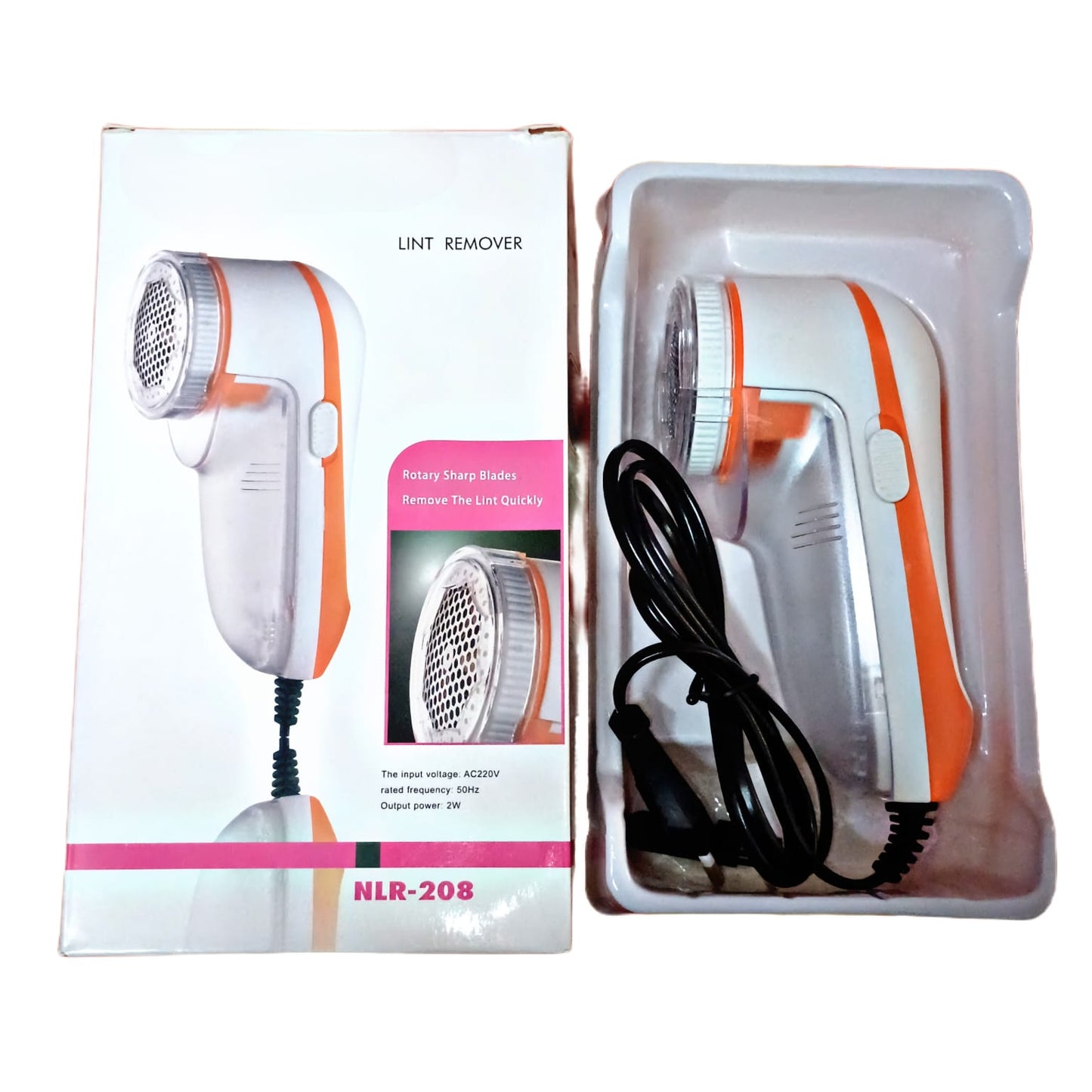 Orange Charkee electric lint remover for woolen clothes, compact lint shaver with ergonomic design, shown in use.