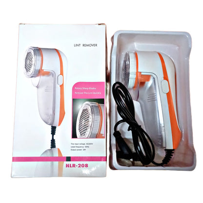 Orange Charkee electric lint remover for woolen clothes, compact lint shaver with ergonomic design, shown in use.