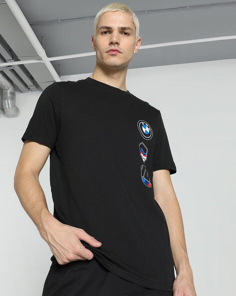 Black BMW M Motorsport men's crew-neck T-shirt with garage logo, regular fit, made by 8969, front view showing logo and design.