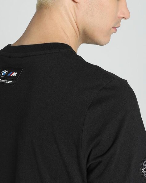 Black BMW M Motorsport garage men's T-shirt with regular fit and crew neck, featuring BMW M branding and Motorsport logo.