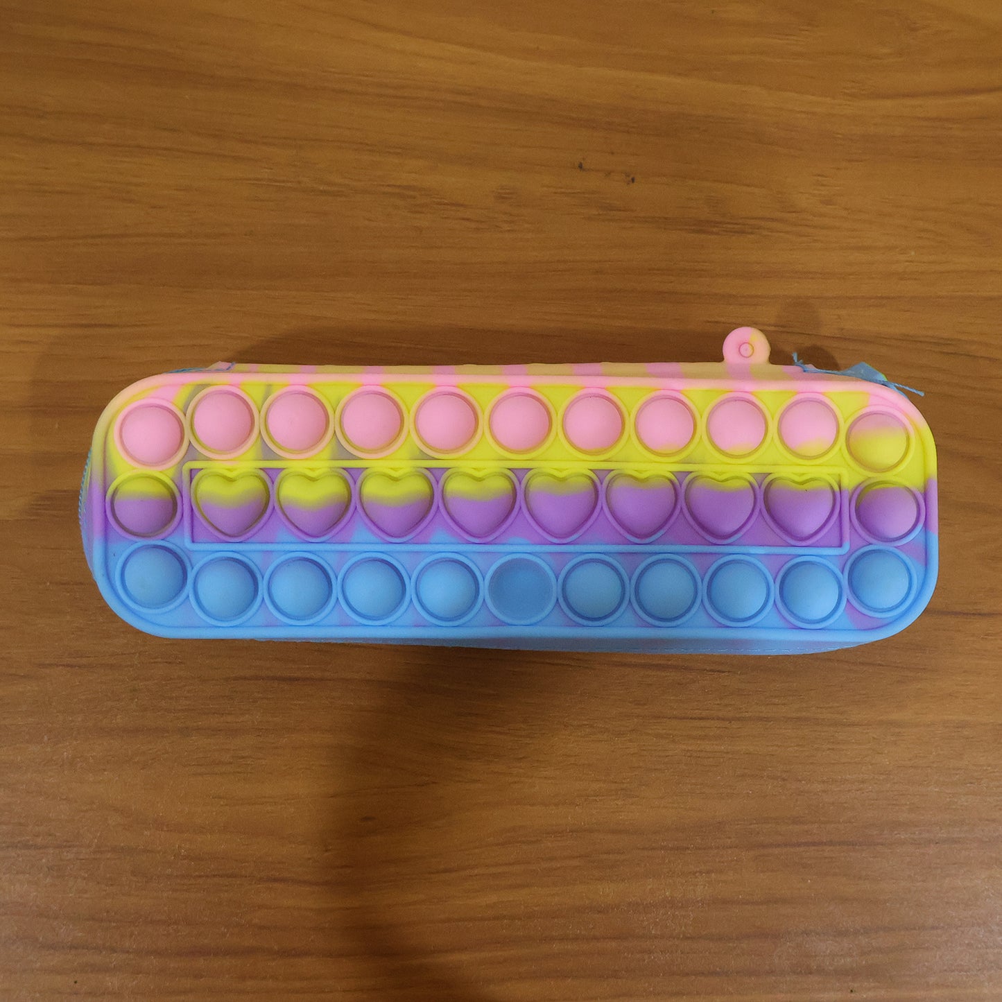 Wukusy Pop It silicone pencil pouch with zipper, colorful and flexible stationery organizer for kids and students.