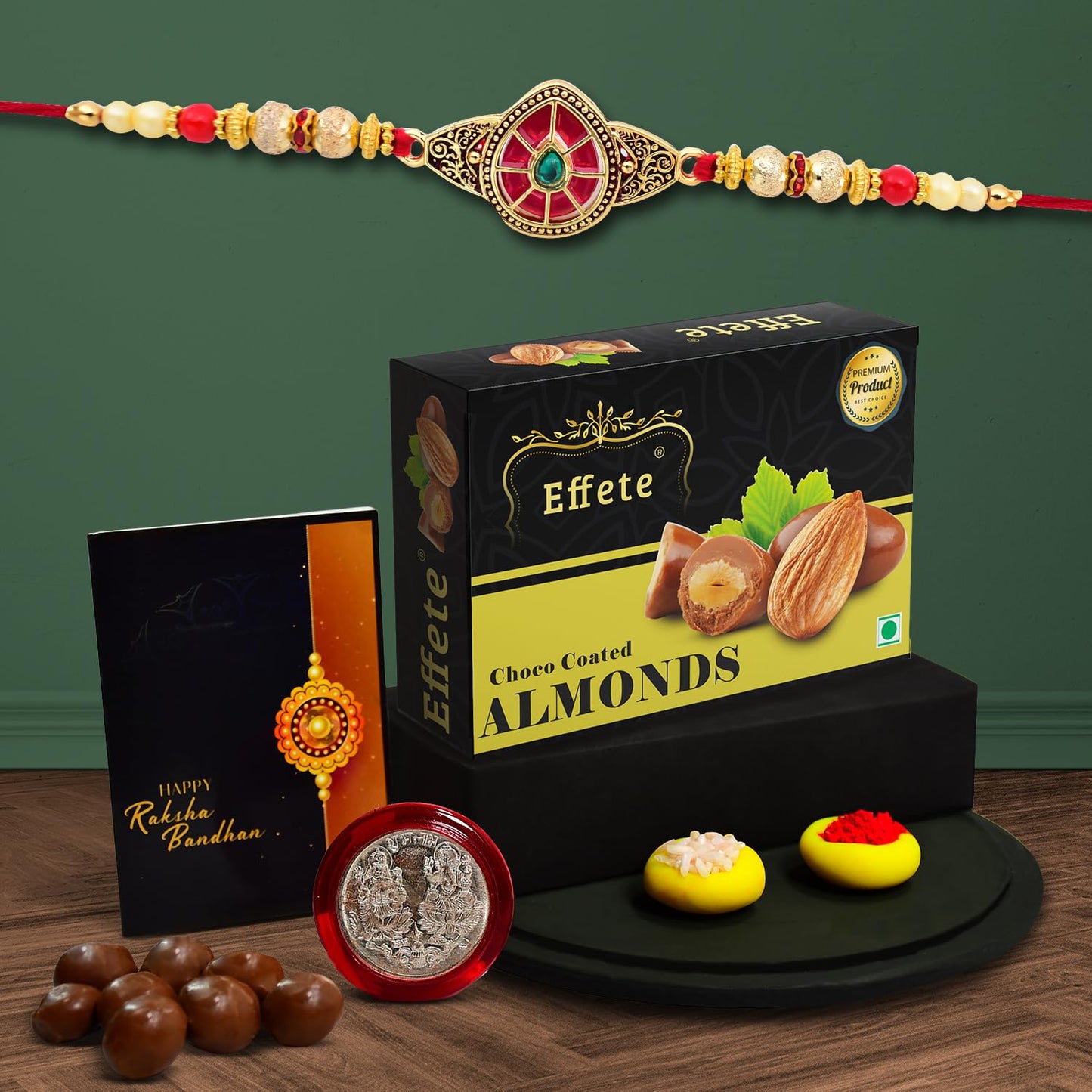 Wukusy Rakhi combo with chocolate almonds, stylish brother gift set featuring a decorative Rakhi and 32g chocolates in a festive display.