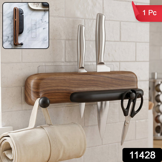 Wall mounted Wukusy knife holder with hooks and roll bag dispenser for organized kitchen storage, mounted on a modern backsplash.