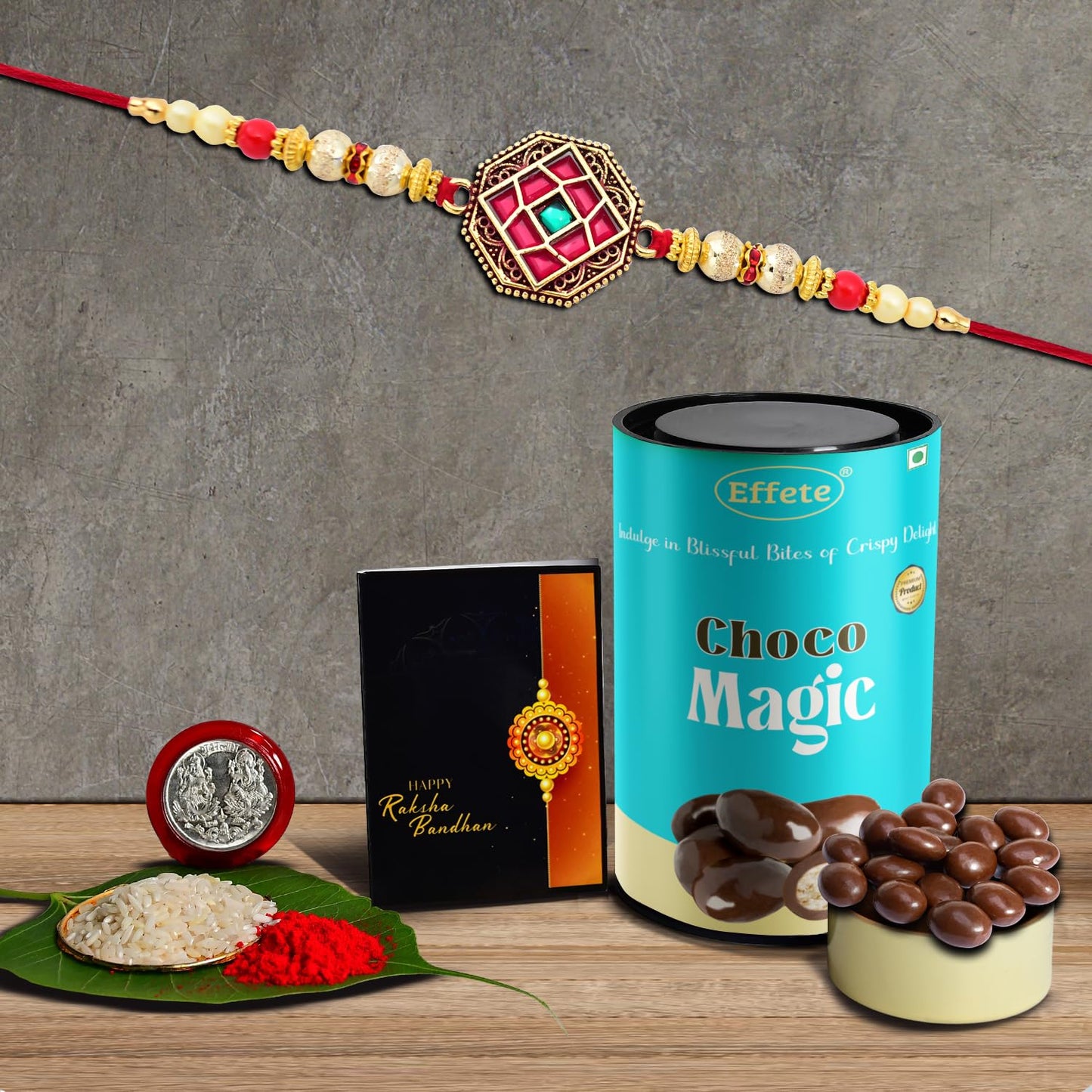 Red design Rakhi and chocolate gift combo by Wukusy featuring a stylish, fancy Rakhi for men for Rakshabandhan celebrations.