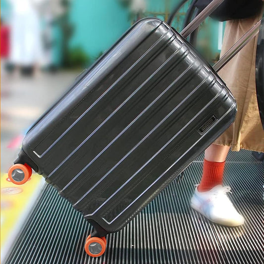 Set of four silicone luggage wheel covers by Wukusy to protect suitcase wheels and reduce noise during travel.