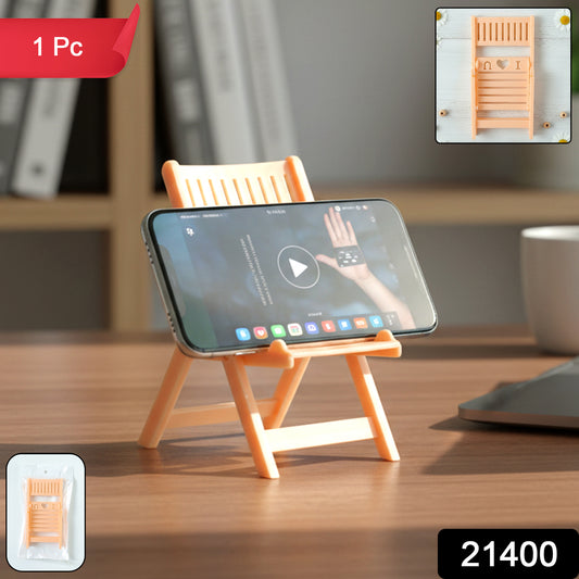 Peach-colored mini chair-shaped mobile stand holder by Wukusy, designed to hold smartphones securely.