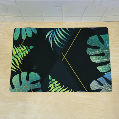 Decorative tropical leaf print floor mat for indoor doorways by Wukusy, 59.5x40 cm, featuring vibrant green tropical leaf design.