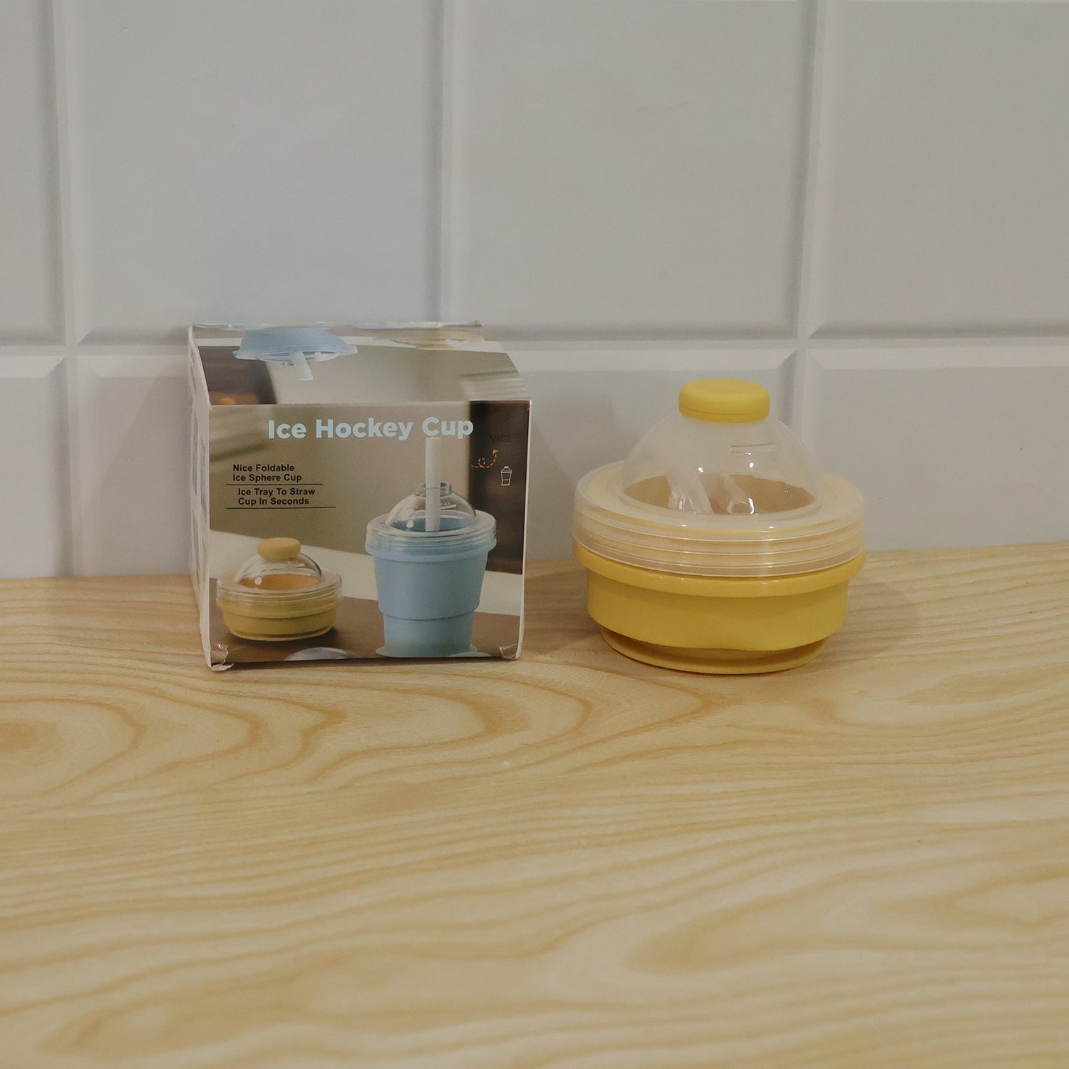 Wukusy silicone foldable travel cup with straw and dome lid, collapsible design ideal for portable hydration.