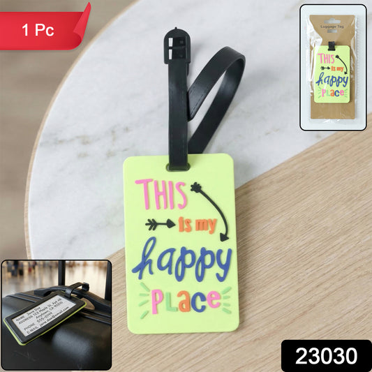 Colorful Wukusy "This Is My Happy Place" travel luggage bag tag with vibrant design, attached to a suitcase.