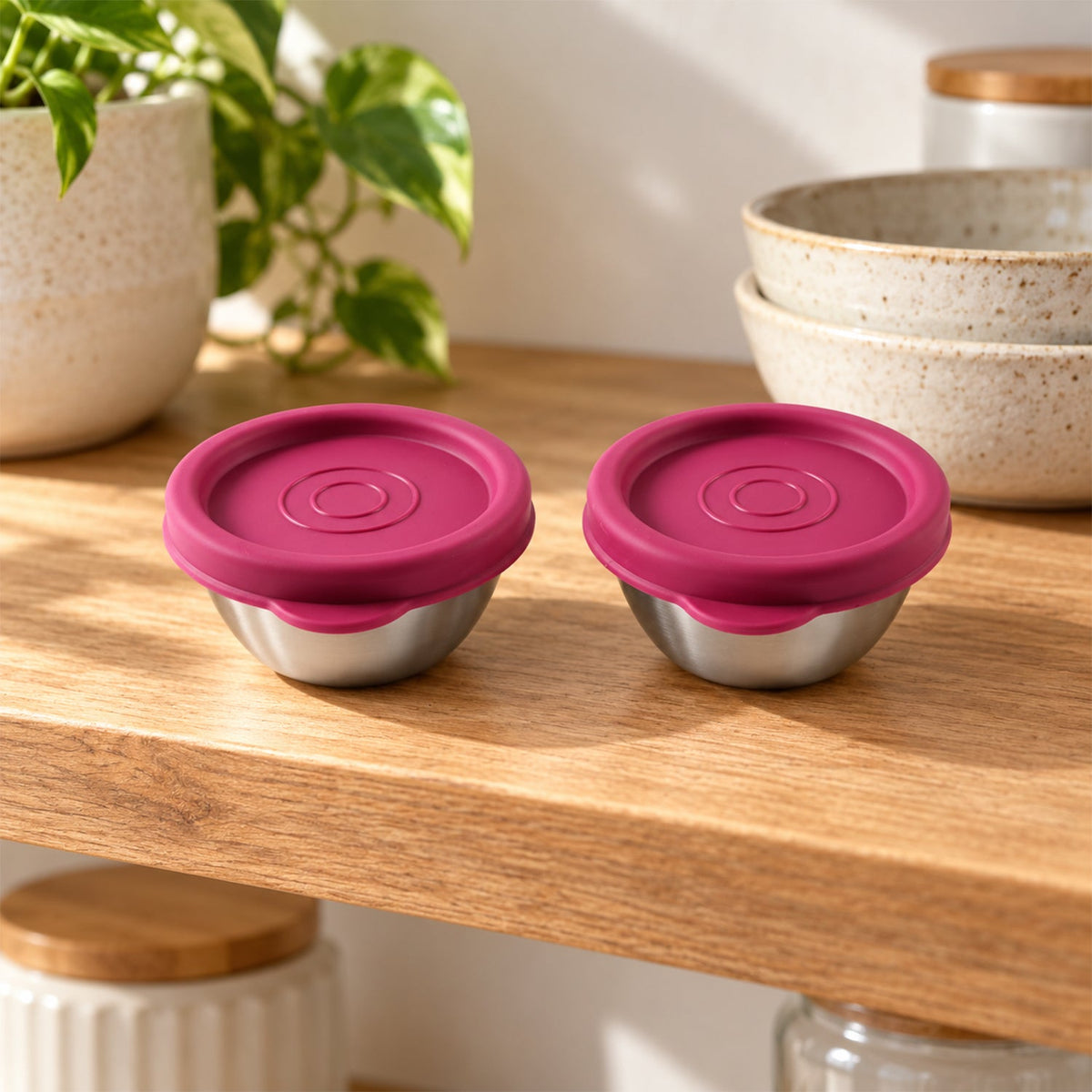 Two Wukusy Apex stainless steel food containers with lids, 70ml size, ideal for snacks and dips, shown with lids on.
