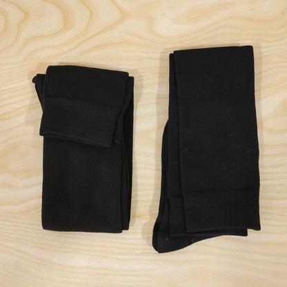 Two pairs of Wukusy long soft stretchable over knee socks in beige and black for casual wear and everyday style.
