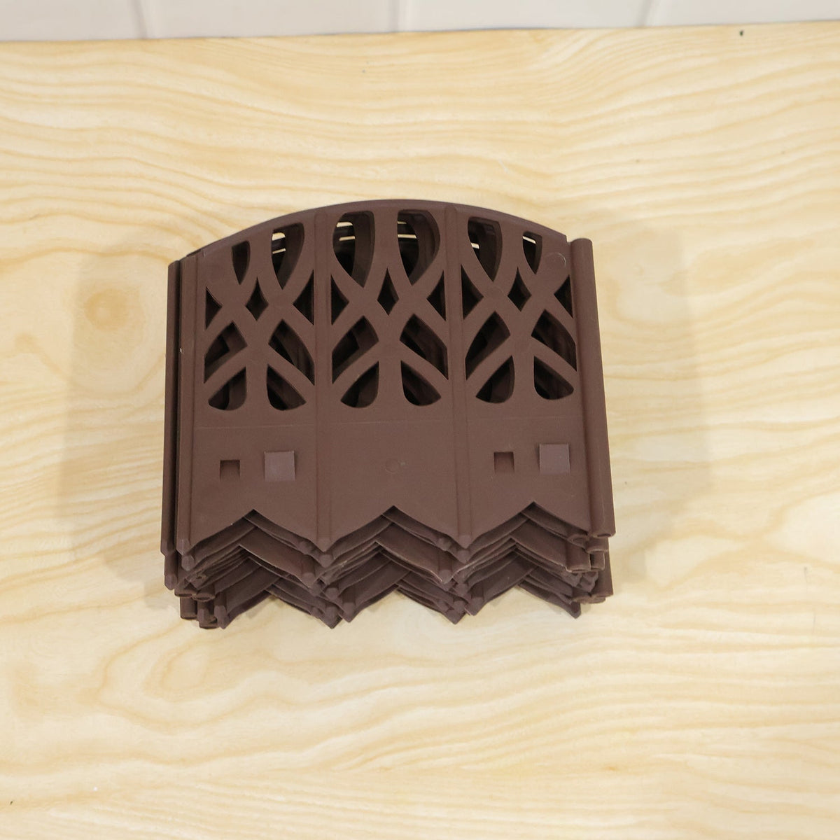 Decorative plastic garden fence border set by Wukusy, ideal for lawn, yard, and flower bed edging, with connected fencing panels.