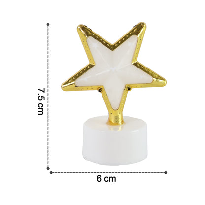 Four Wukusy decorative star-shaped flameless LED candles for home decor, glowing softly in a cozy setting.