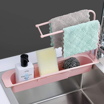 Wukusy over-sink expandable sink caddy with dual towel bar and drip tray for organizing kitchen essentials.