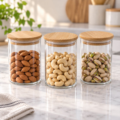 Set of three Wukusy glass storage jars with bamboo lids, ideal for kitchen organization and storing dry fruits.
