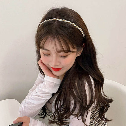 Elegant pearl design Wukusy hairband featuring a classic style with pearl accents, perfect for adding a touch of sophistication