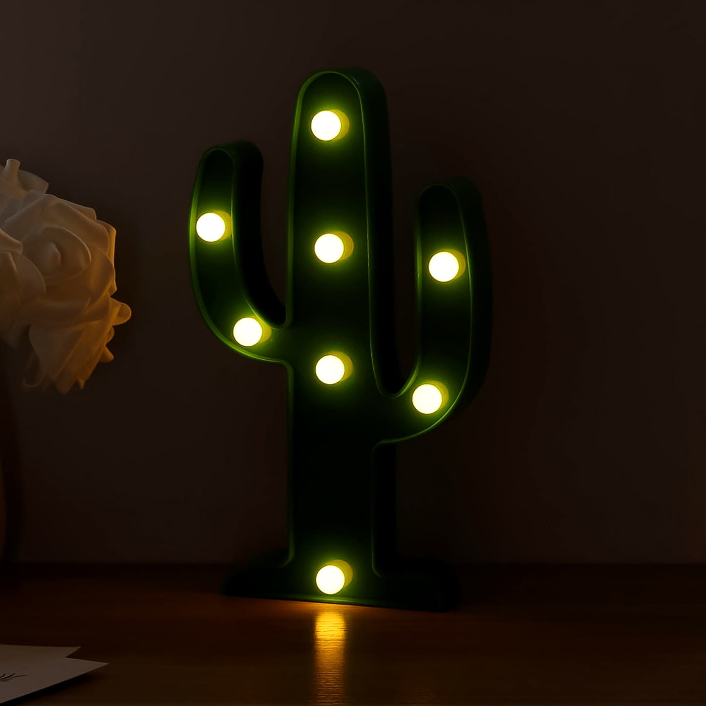 Wukusy LED cactus desk lamp on office table, battery not included, providing a fun and functional lighting accent for workspace.