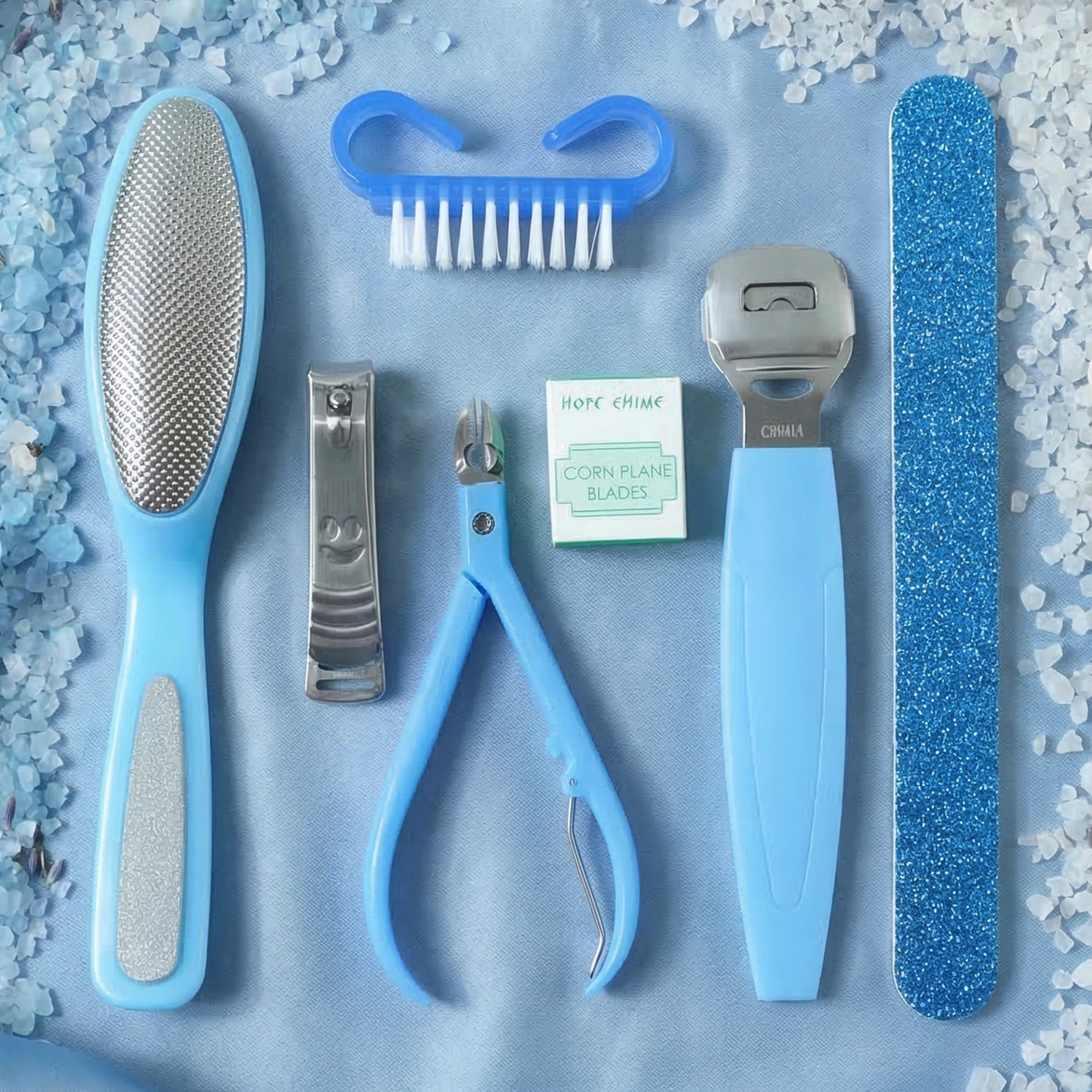 Wukusy 7-in-1 pedicure and manicure foot care tool kit with various stainless steel tools on a white background.