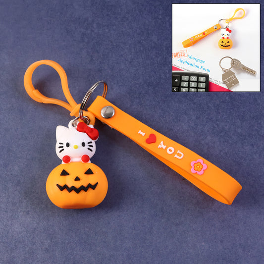 Cute cartoon cat pumpkin silicone keychain by Wukusy featuring a playful cat design on an orange pumpkin-shaped accessory.