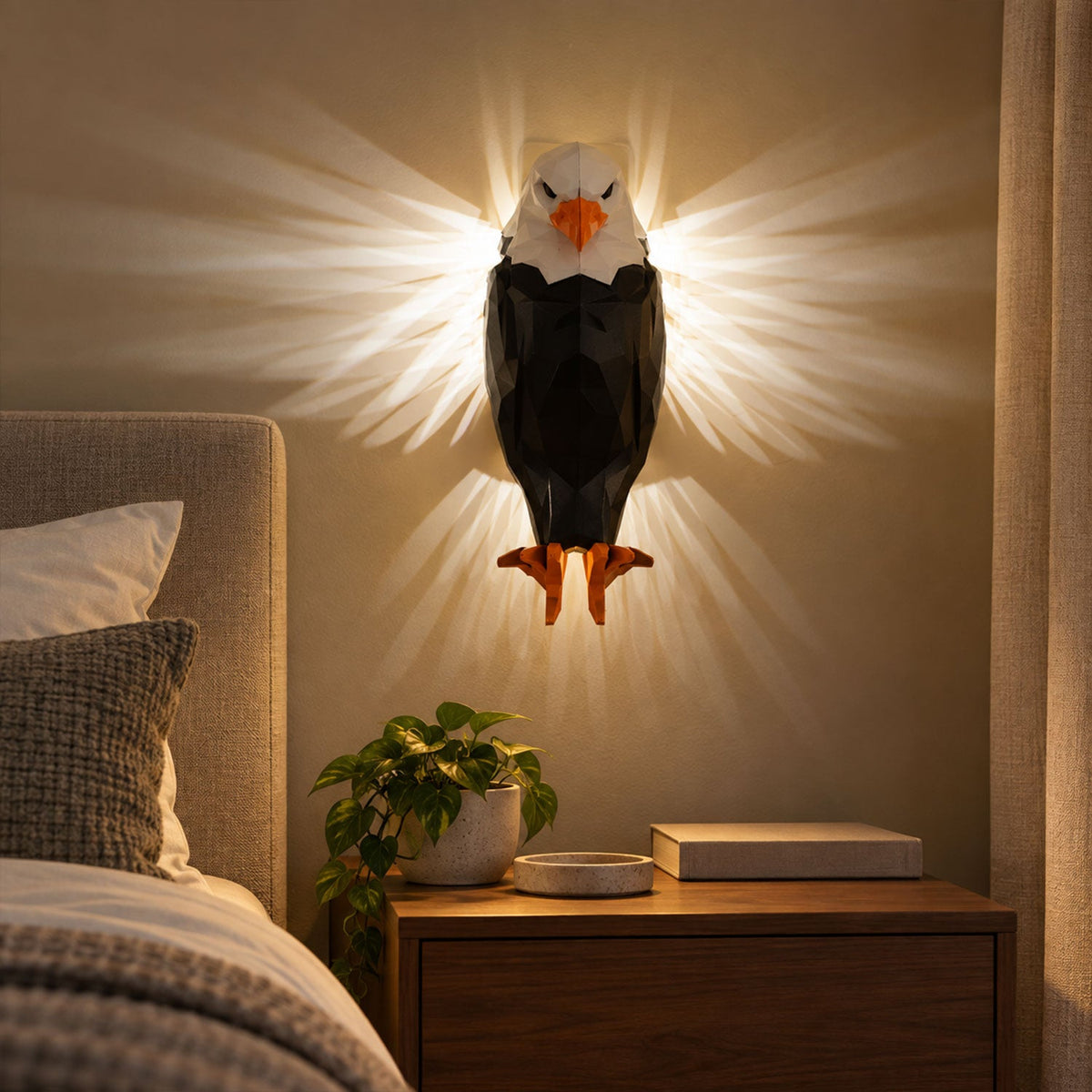 Wukusy eagle-shaped LED ambient wall light with remote and magnetic holder, mounted on a wall in a modern interior setting