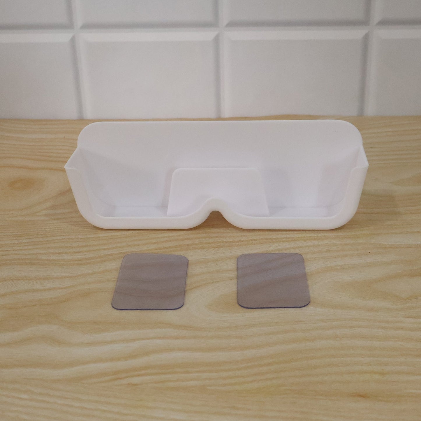 Wall-mounted Wukusy plastic sunglasses holder stand with adhesive, designed for organizing eyewear neatly on walls.