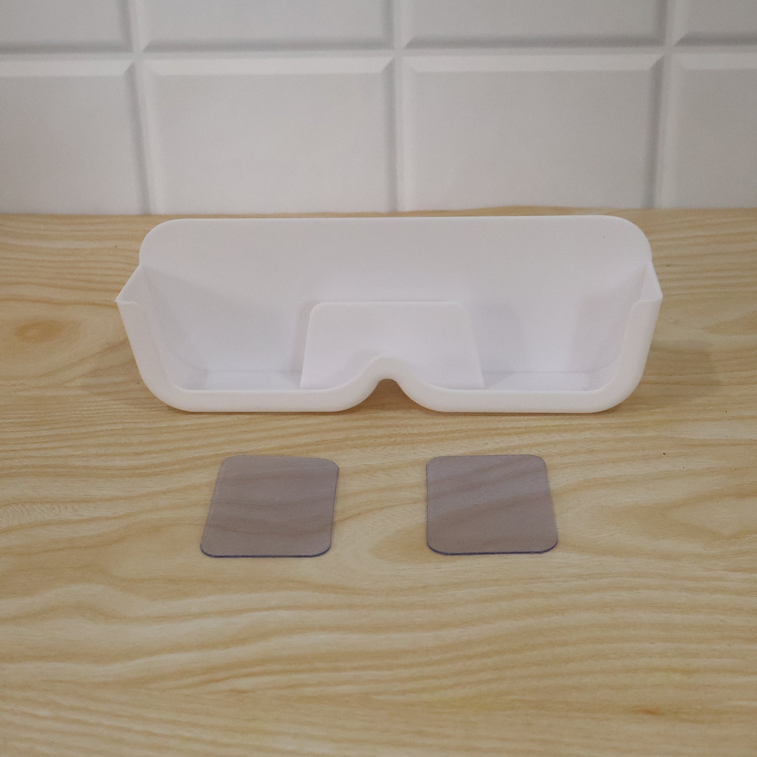 Wall-mounted Wukusy plastic sunglasses holder stand with adhesive, designed for organizing eyewear neatly on walls.