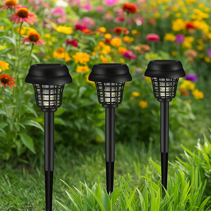 Set of five Wukusy solar-powered mosquito killer garden lights installed outdoors on a garden path at dusk.