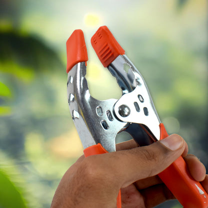Heavy-duty 6-inch metal spring clamp by Wukusy, showing the clamp's spring mechanism and sturdy construction for holding materials.