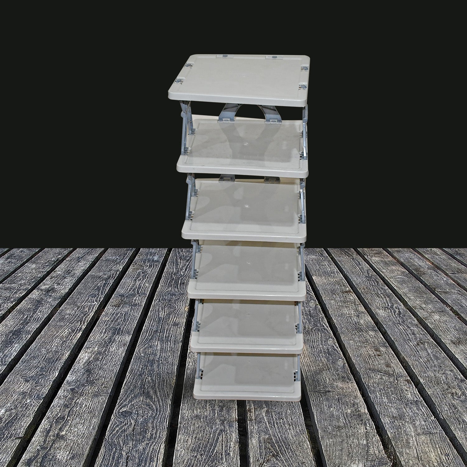 Wukusy foldable shoe rack with multiple layers, made of durable plastic, for organized footwear storage in entryways or closets.