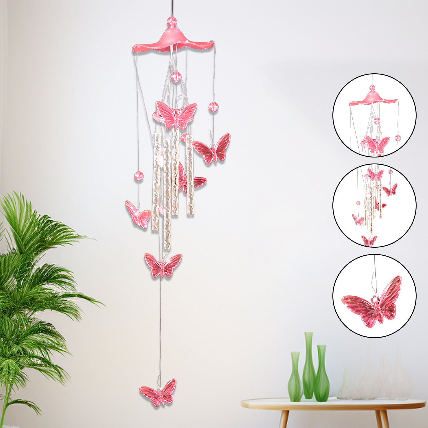 Wukusy Butterfly Bell Wind Chimes featuring colorful butterfly designs hanging from metal tubes outdoors