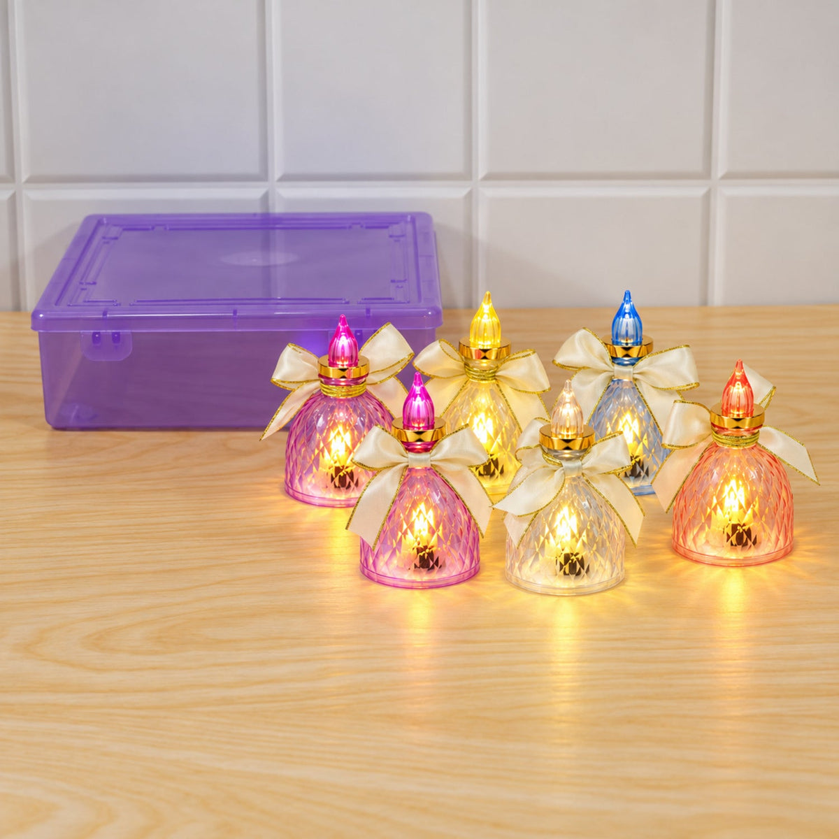 Set of six decorative flameless LED candle lights with bows by Wukusy, ideal for home decor and cozy ambiance.