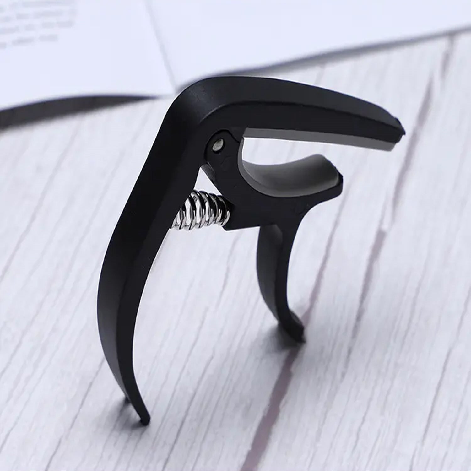 Wukusy 6141 guitar capo with pickup stand and soft pad for acoustic, electric guitar, ukulele, mandolin, and banjo accessories.