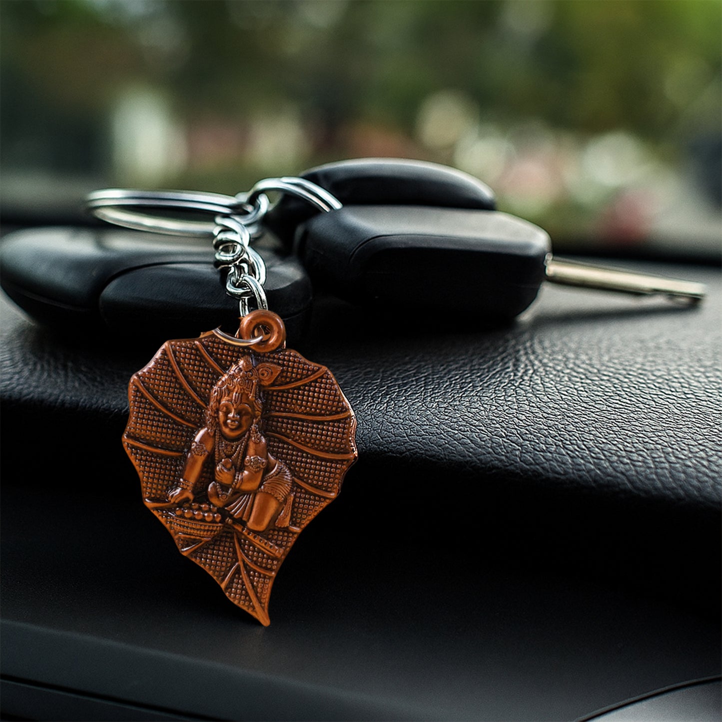 Antique-finish metal keychain by Wukusy featuring intricate design and premium craftsmanship, displayed on a neutral background.