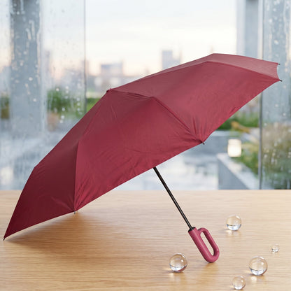 Wukusy portable windproof travel umbrella, compact and durable for rain and sun, shown open with black canopy and handle.