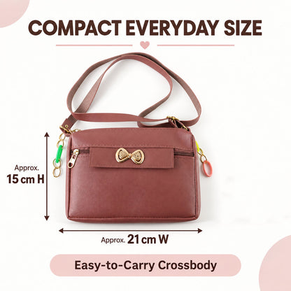 Wukusy women's PU leather sling bag with adjustable strap and decorative bow, featuring a compact design and stylish appearance.