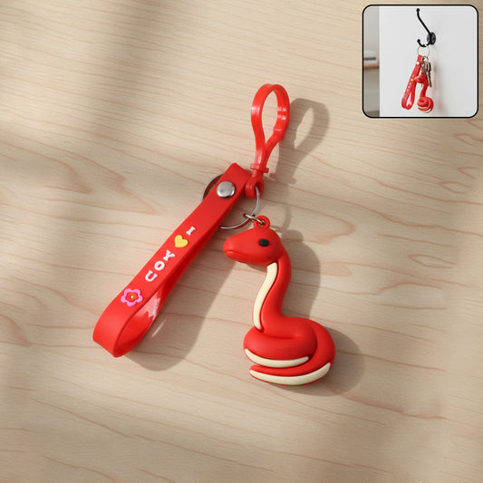 Cute cartoon snake keychain from Wukusy, featuring a colorful, playful snake design on a metal keyring.