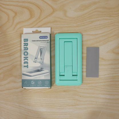 Wukusy foldable plastic mobile phone holder stand on a desk, adjustable for viewing, suitable for office use.