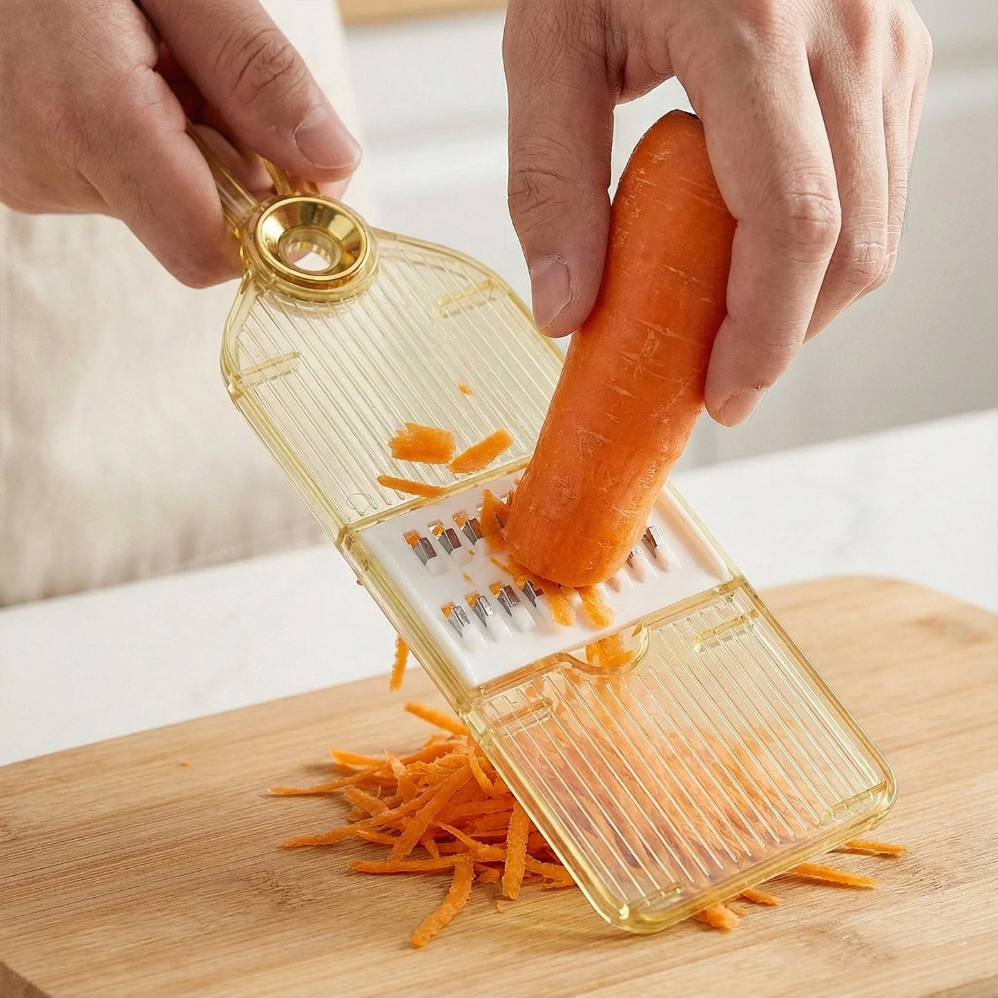 Wukusy handheld vegetable cutter and slicer for kitchen, showing the multipurpose veggie chopper with blades and handle in use