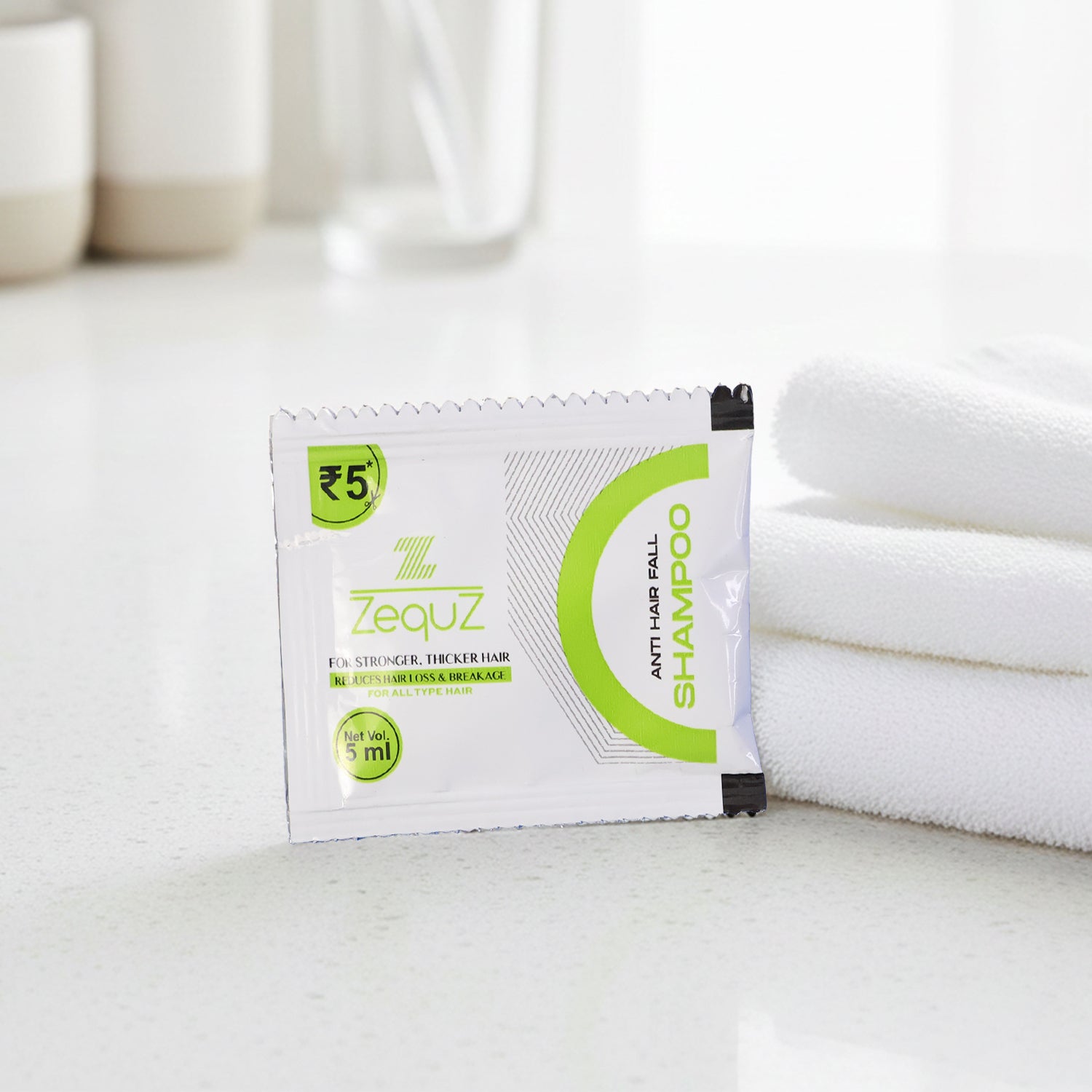 Wukusy Zequz anti-hair fall strengthening shampoo sachet, 5ml single-use packet, featuring herbal ingredients for hair care.