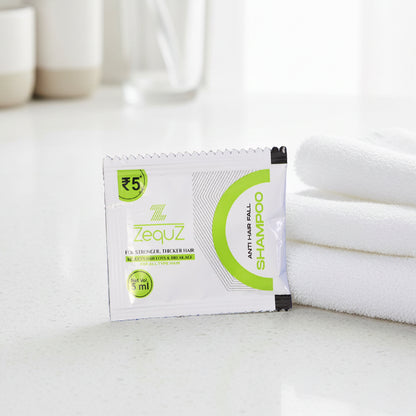Wukusy Zequz anti-hair fall strengthening shampoo sachet, 5ml single-use packet, featuring herbal ingredients for hair care.