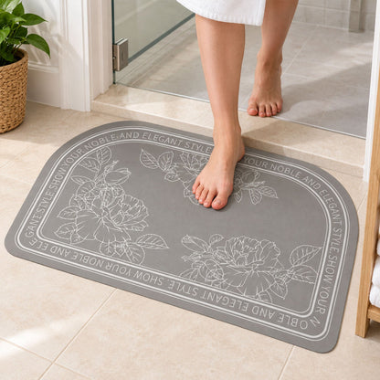 Wukusy absorbent bathroom mat with half-round floral print, quick-drying fabric, measuring 50x80 cm, placed on a bathroom floor.