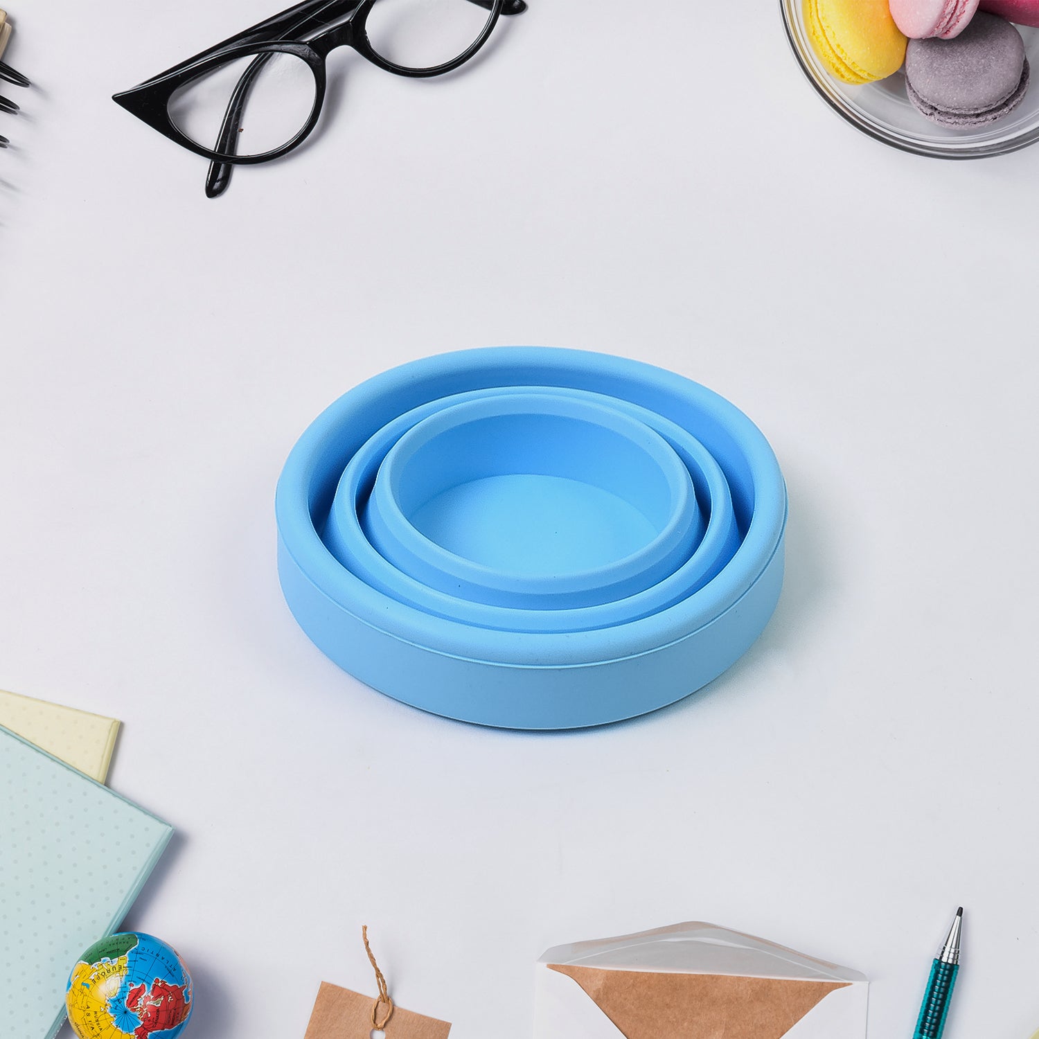 Wukusy round silicone foldable travel mug without lid, portable and collapsible for easy use at home or on the go.