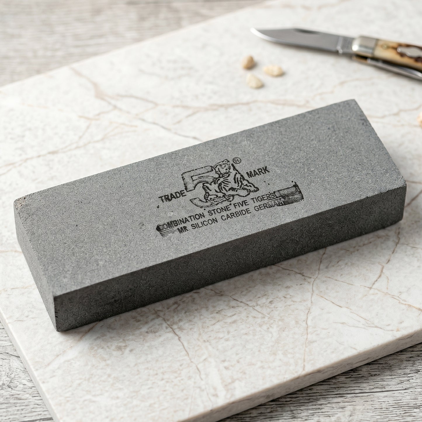 Wukusy silicon carbide combination whetstone for knife sharpening, featuring coarse and fine grit surfaces in a single stone.