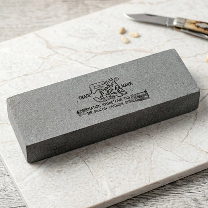 Wukusy silicon carbide combination whetstone for knife sharpening, featuring coarse and fine grit surfaces in a single stone.